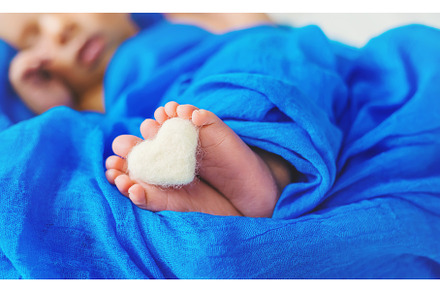 Newborn baby sleeping on a blue, a Person Photo by yanadjana