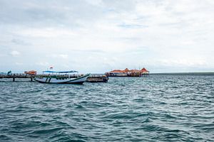 Fishing boats docked at Pulau Liukang Loe, Sulawesi, Indonesia, a Nature Photo by GoodGoods