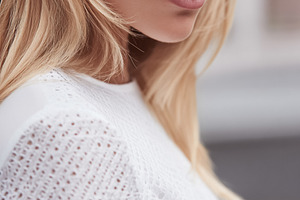 Blonde woman wearing trendy white lace top, showcasing modern fa, a Photo by Studio ANNA