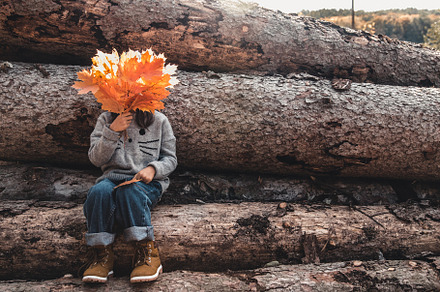 girlchildren holding autumn leaves
