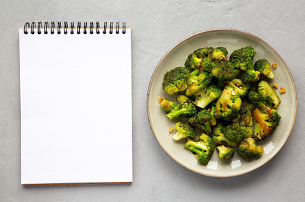 Homemade Pan-Fried Broccoli on a Plate, top view. Flat lay, over, a Food & Drink Photo by LiudmylaChuhunova