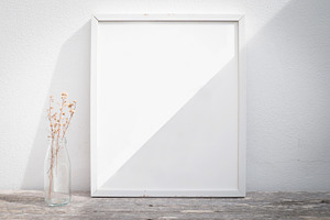 vintage blank picture frame and sunl