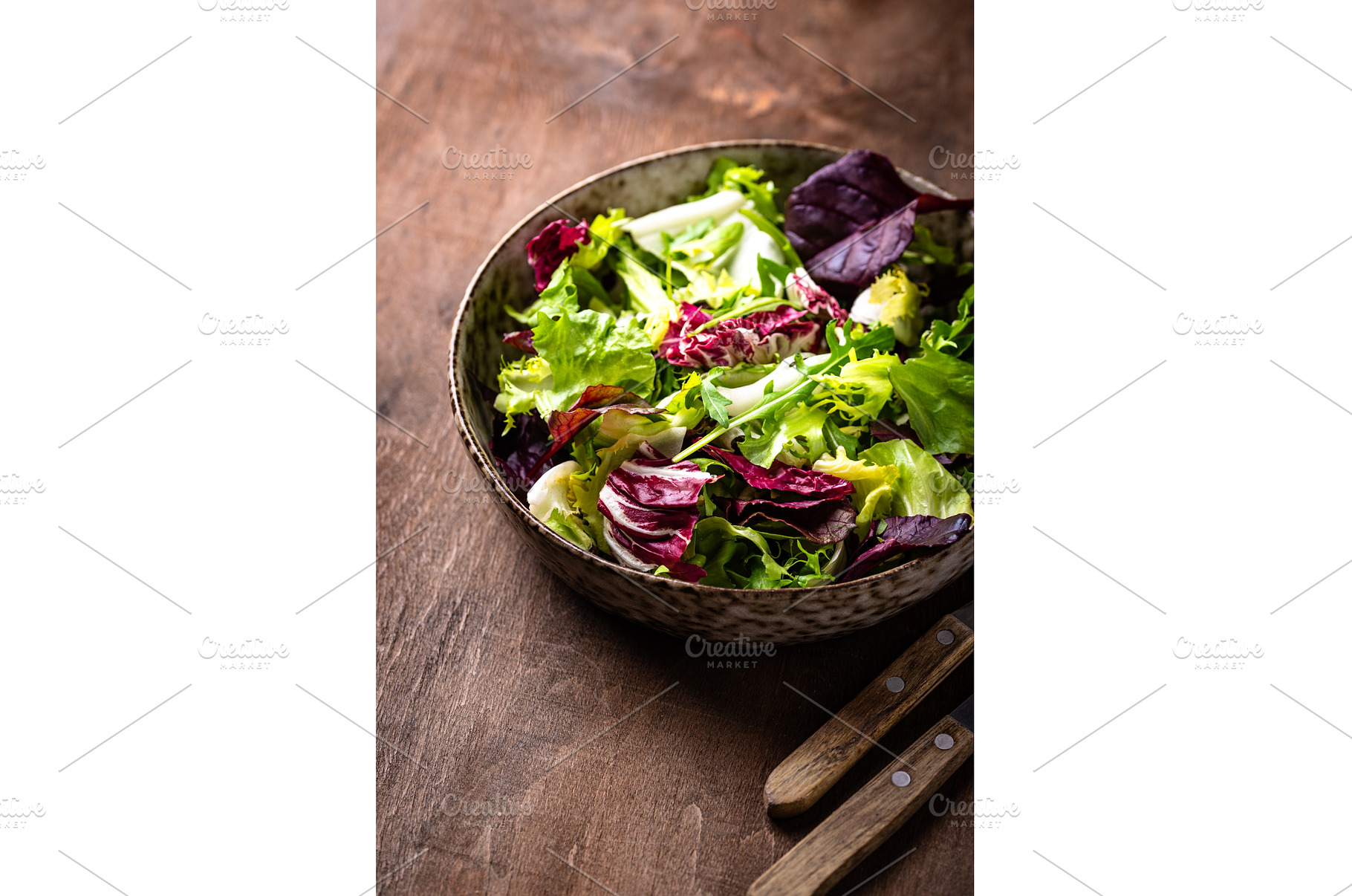 Bowl of fresh green salad mix, a Food & Drink Photo by Yulia Furman