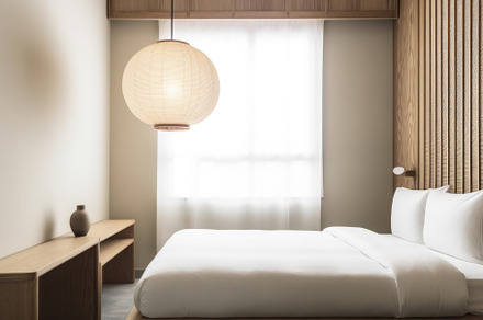 Hotel room with neutral tones, minimalist furniture, and a touch of Zen-like tr, an Architecture Photo by zakiroff