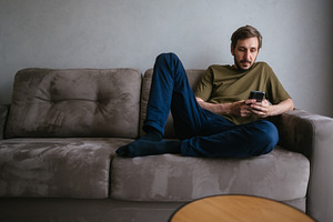 Man relaxing on a comfortable sofa