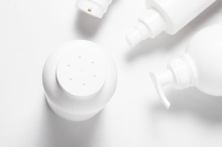 White plastic talcum bottle with perforated cup, an Industrial Photo by MDBildes