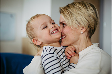 Beautiful mother hugging and kissing, a Person Photo by HalfPoint
