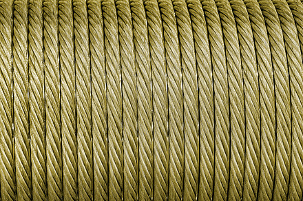 The texture of a new golden color cable wrapped in a spool. Abst, an Abstract Photo by Eugene_Photo