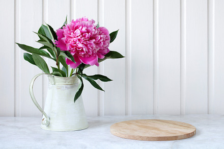 pink peony and cutting board, a Photo by BalaguR
