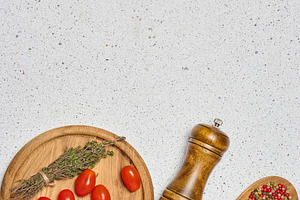 A flat lay shot of a wooden bowl with spinach, cherry tomatoes o, a Food & Drink Photo by ndanko