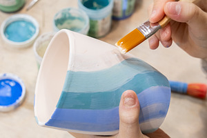 Ceramic art pottery class child hand painting, an Arts & Entertainment Photo by Photo Drive Studio