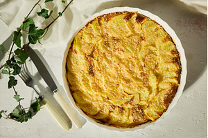 Golden gratin on a rustic table., a Food & Drink Photo by IlliaBondarPhotography