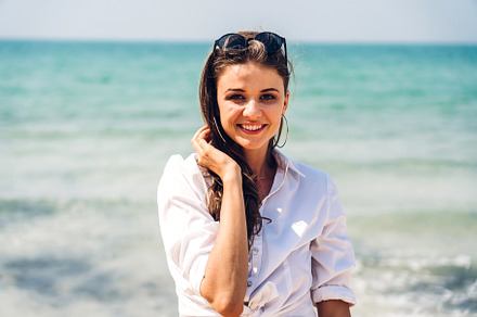 Portrait of smiling fashion woman relaxation on the tropical bea, a Person Photo by Art_Photo
