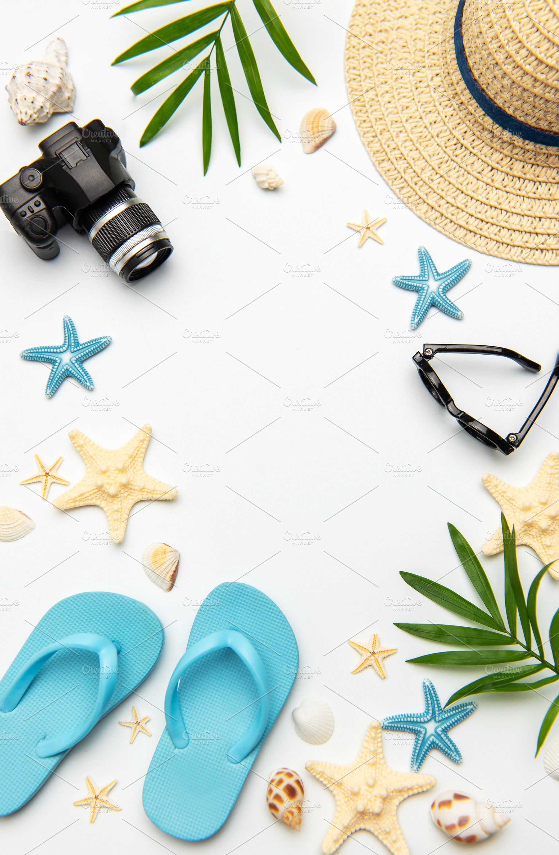 Summer accessories creating a frame on white background with cop, a Holiday Photo by Olena Rudo