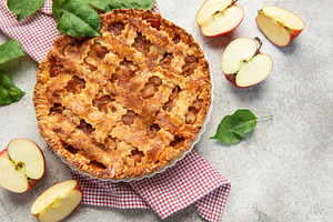 Freshly baked apple pie with lattice crust and sliced apples, a Food & Drink Photo by Olena Rudo