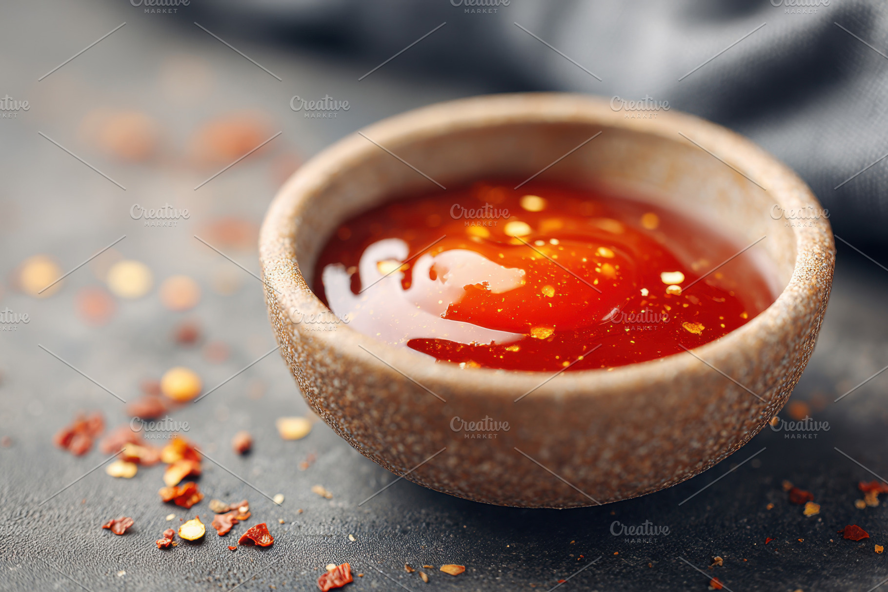 Bowl of spicy sauce with red pepper flakes, a Food & Drink Photo by AlyaAnd