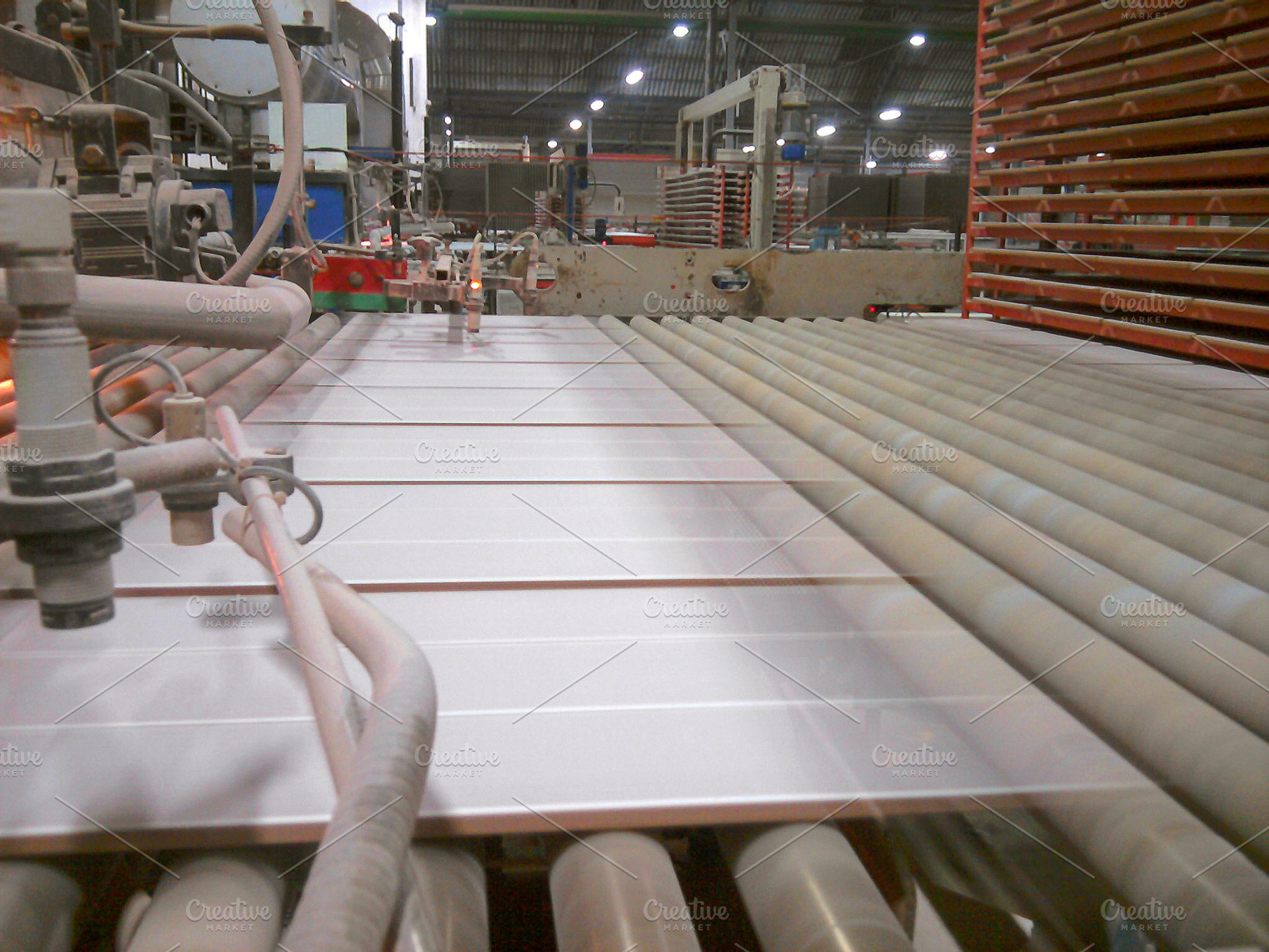 Ceramic tiles entering kiln on conveyor line, an Industrial Photo by Davizro's Market