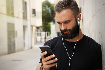 Hispanic young confident man stands containing technology, male, and man