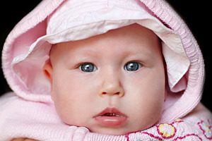 Newborn baby close up, a Photo by saiko3p