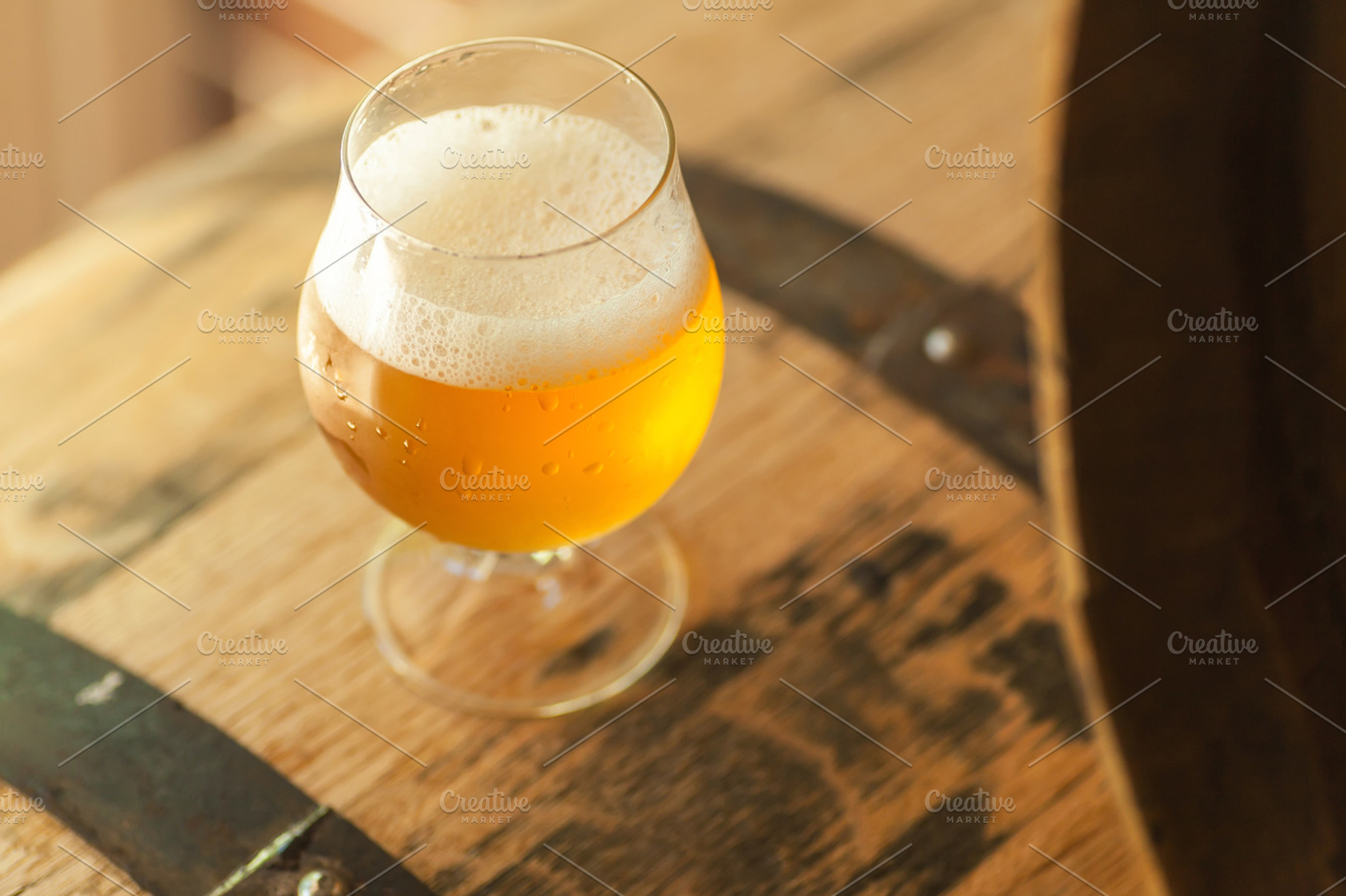 Light beer on a barrel featuring alcohol, ale, and amber, a Food & Drink Photo by Hidden Hallow