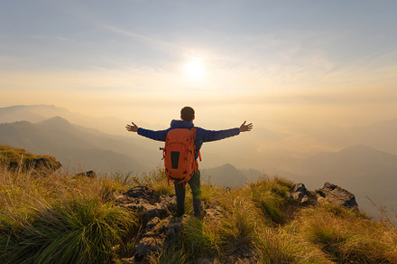Portrait of Asian man, a tourist or backpacker, travel on green, a Person Photo by Tampatra