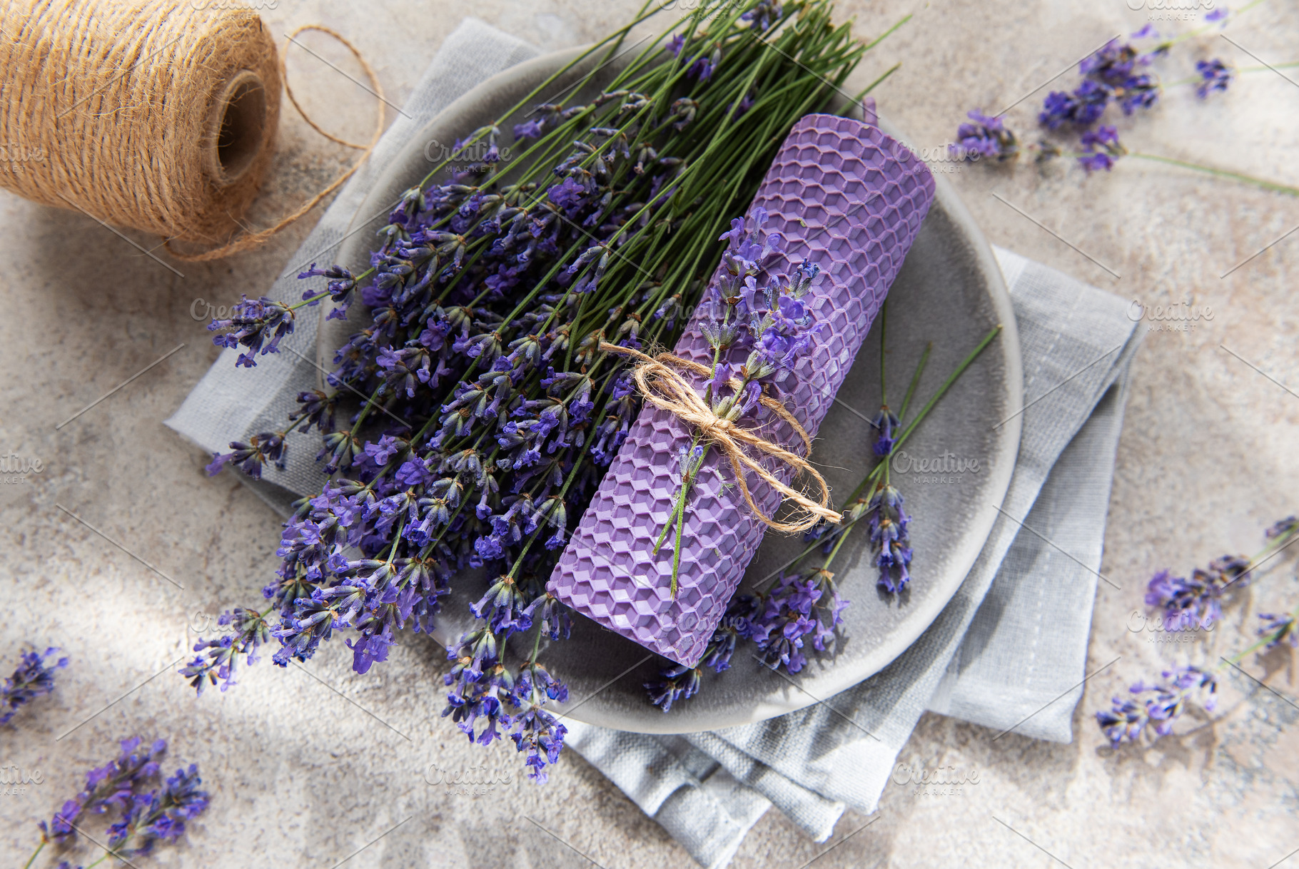 Lavender beeswax candle with natural rustic twine, a Health & Medical Photo by Olena Rudo