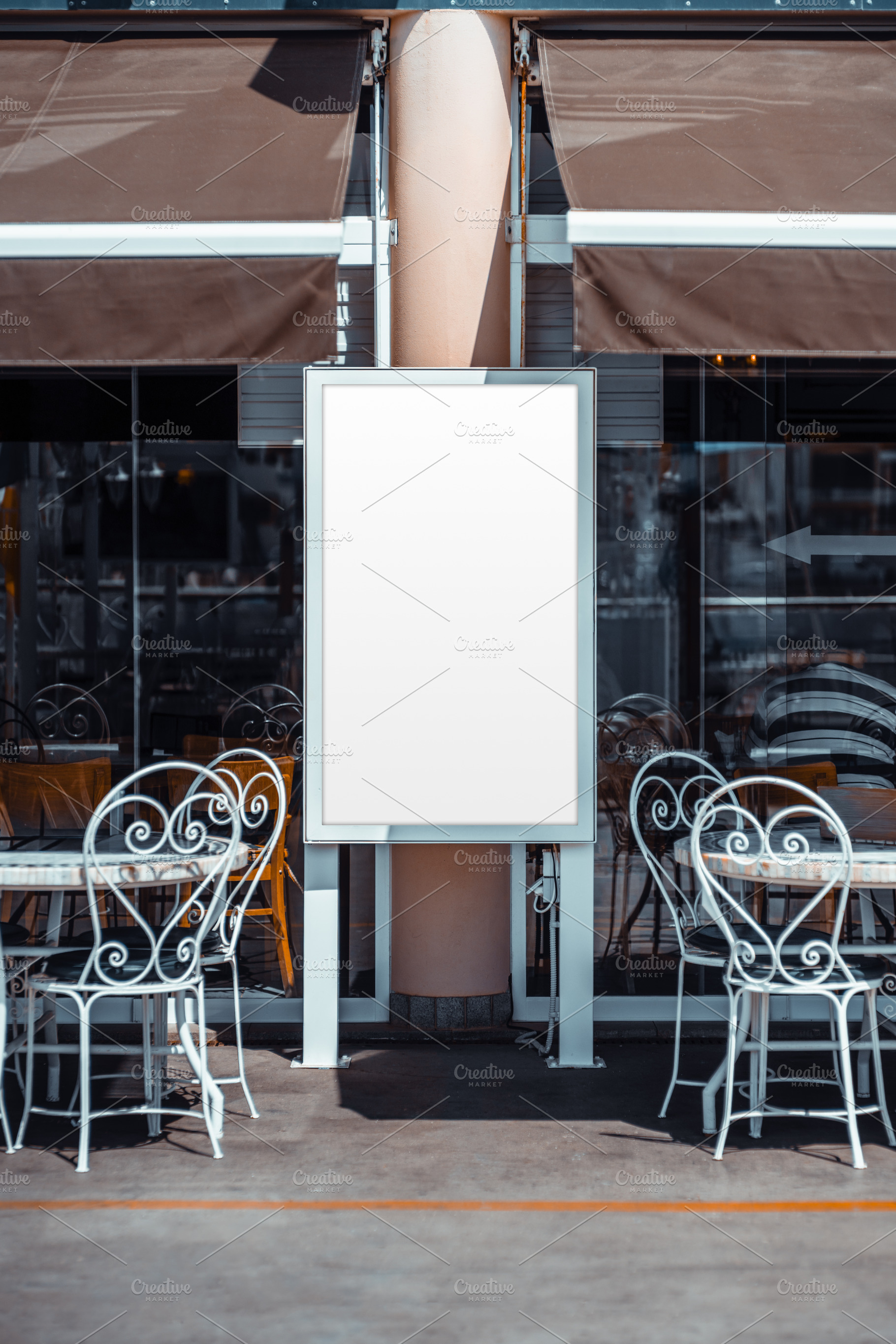 Blank Poster Mockup at Cafe Tables, a Business Photo by SkyNext