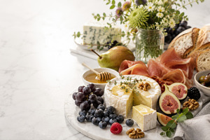 Cheese and fruit platter with bread, a Photo by Beautiful things