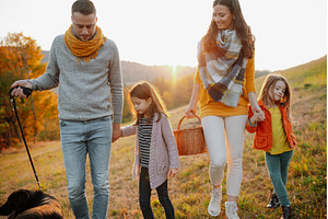 Happy young family with two children, a Person Photo by HalfPoint