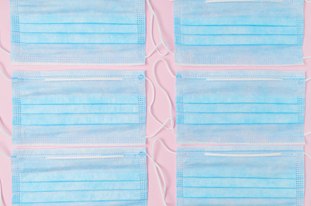 Covid flat lay with medical mask on featuring flu, health care, and covid, an Abstract Photo by Alliance Images