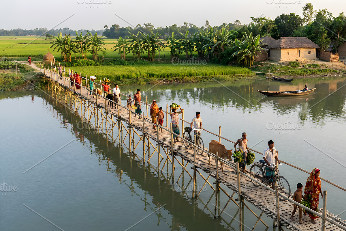 Villagers crossing a bamboo bridge, a Person Photo by nandinigraphics (Photo 2 of 3)