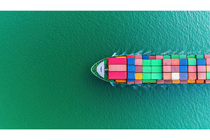Aerial view of cargo ship navigating, a Transportation Photo by Lermont51