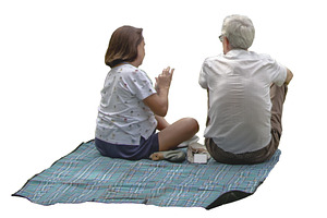 Couple sitting on picnic blanket