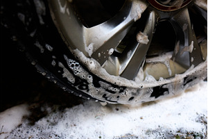 Cleaning car wheel with soap and, a Nature Photo by IlliaBondarPhotography