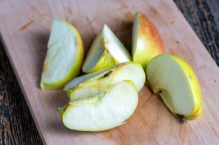 Sliced ripe apple on a cutting board, a Photo by MyPhotos