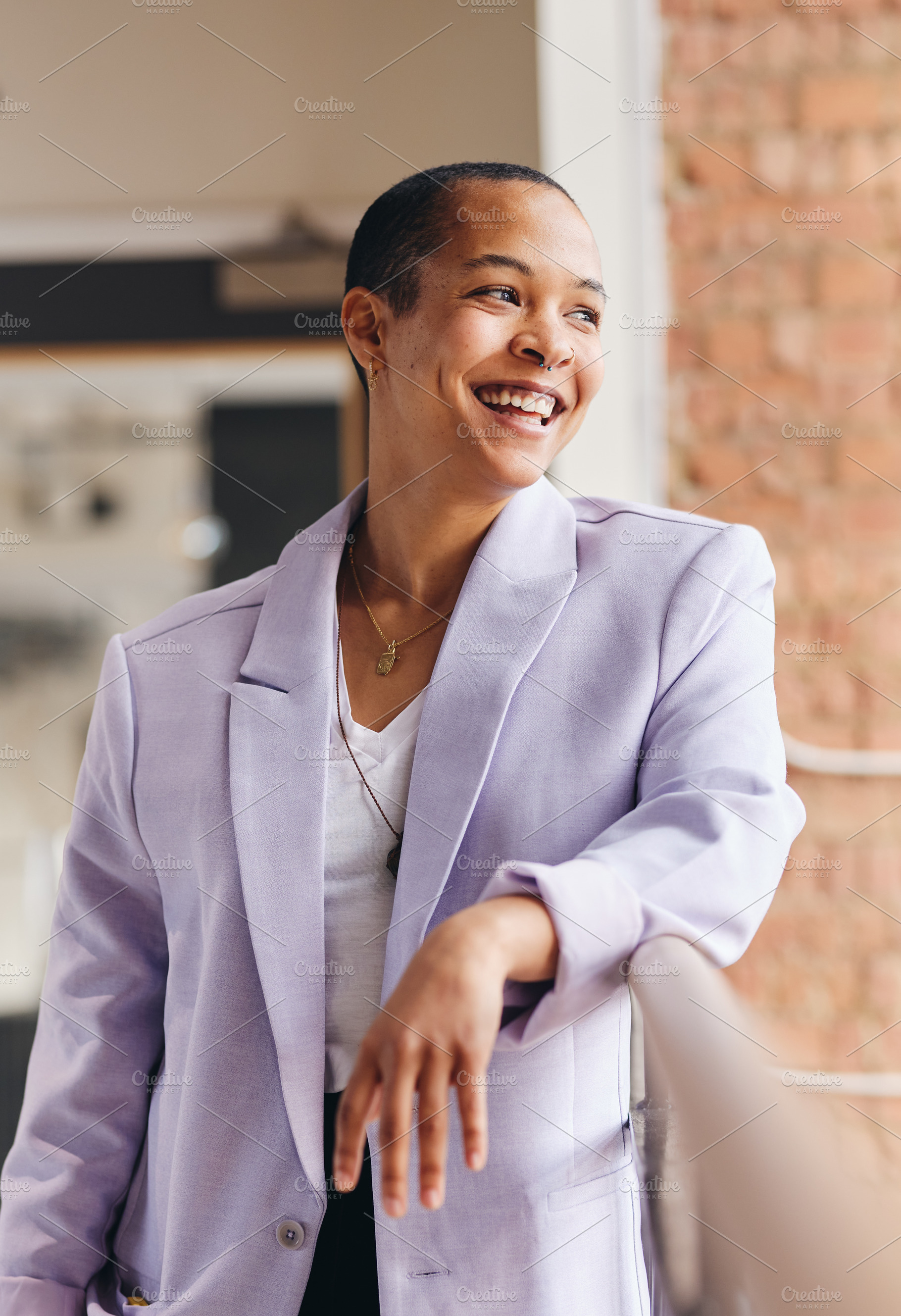 Portrait of confident mixed race LGBTQ mid adult woman smiling and looking away, a Technology Photo by Southworks