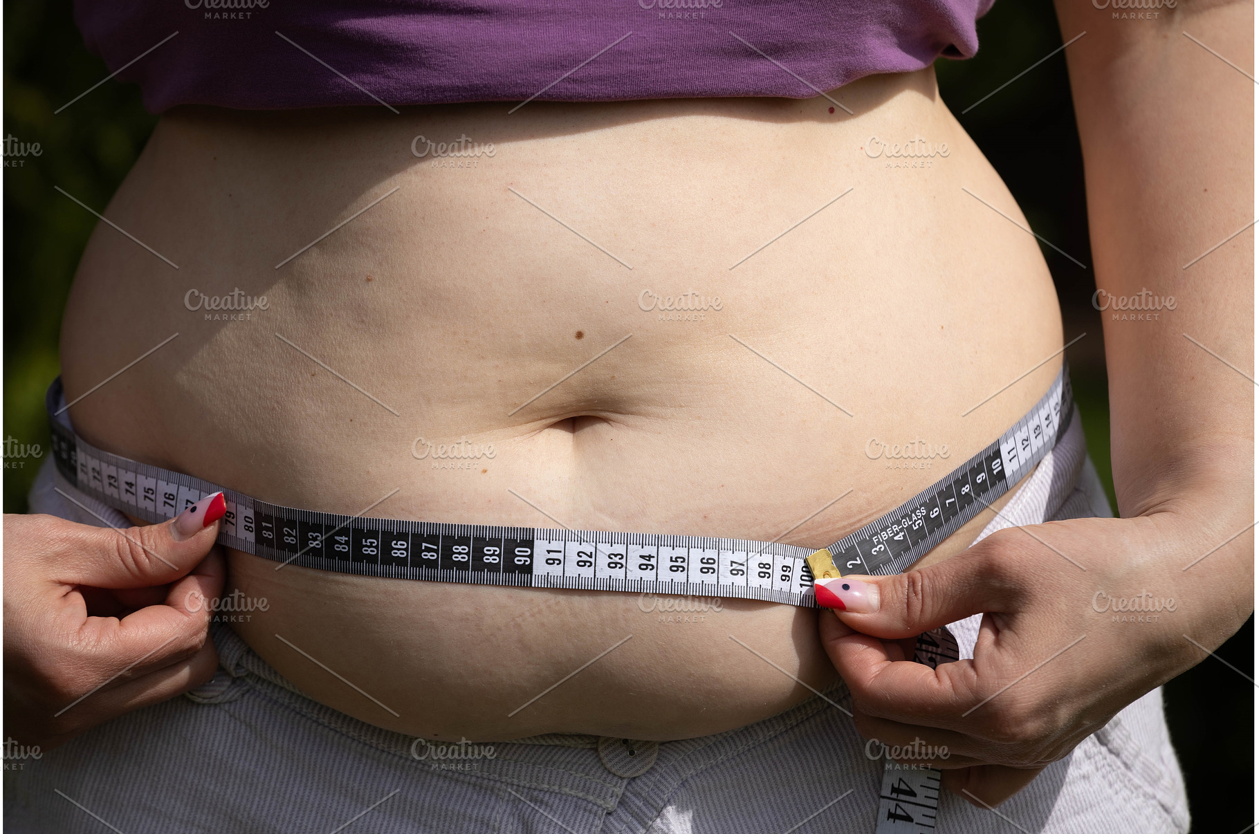 Woman's belly with fat. A plump, a Person Photo by Nenahliadava Design