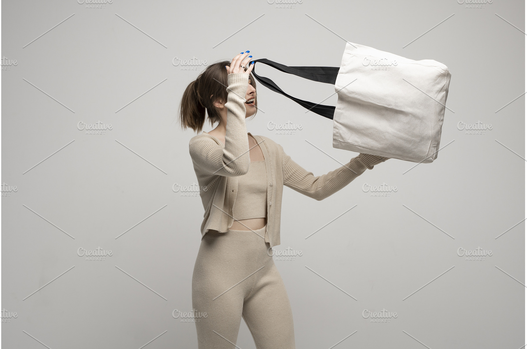 Young woman in beige clothes looking, a Person Photo by volodymyrshtun13795