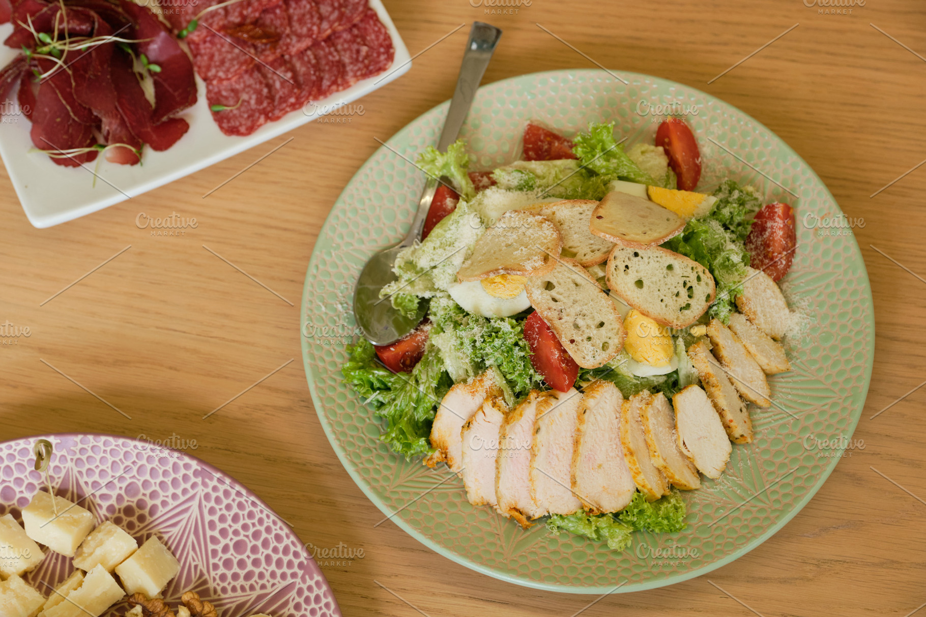 Classic Caesar salad with grilled chicken breast, boiled eggs and croutons on g, a Food & Drink Photo by Rohan Photography