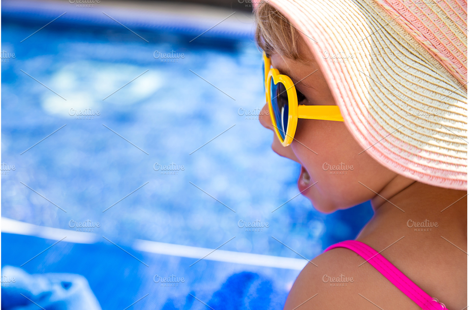 Child near the pool in sunglasses, a Sports & Recreation Photo by yanadjana