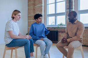 Family therapy session in comfortable room, a Photo by DanFLCreativo