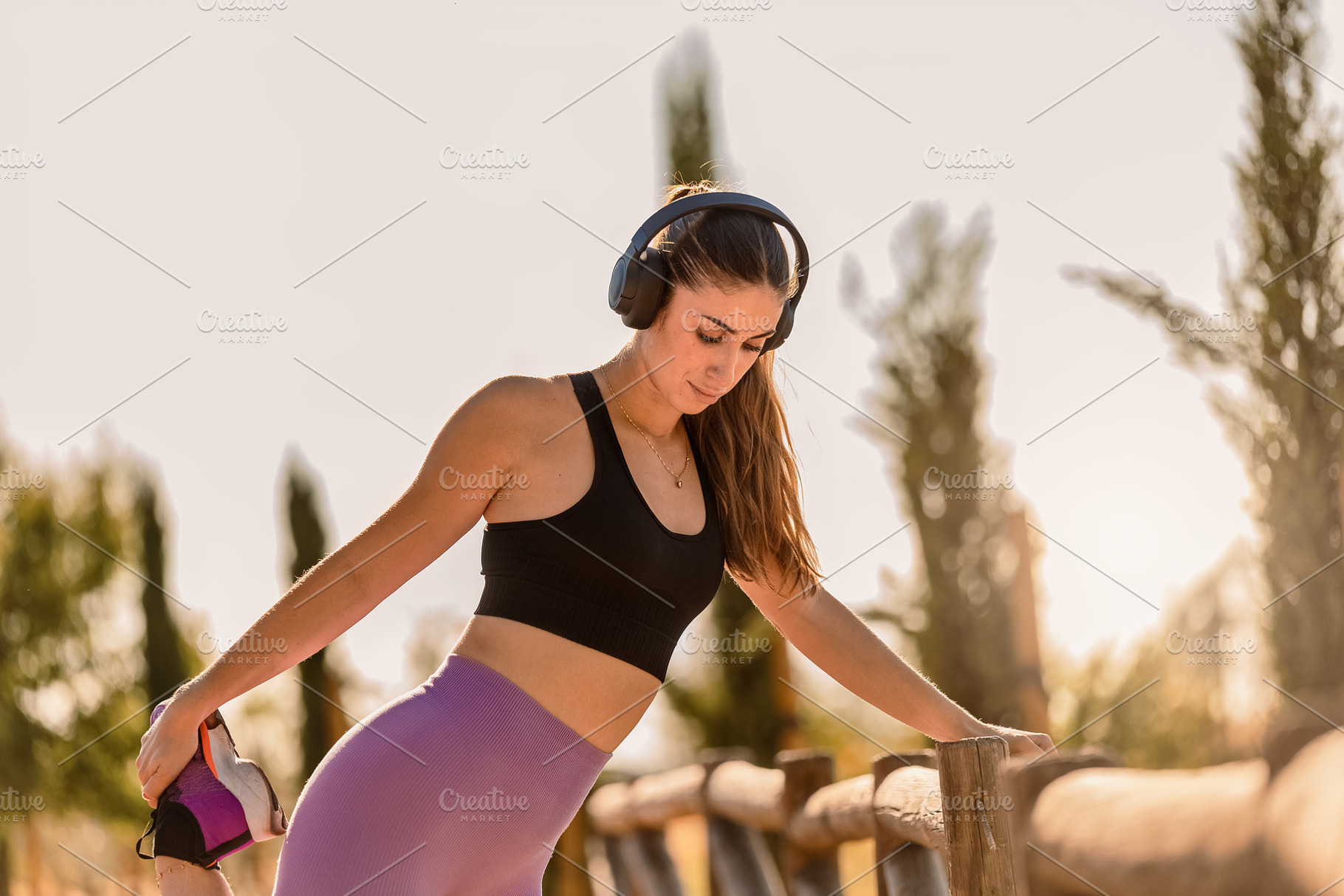Young woman stretching leg wearing s, a Sports & Recreation Photo by Perpis