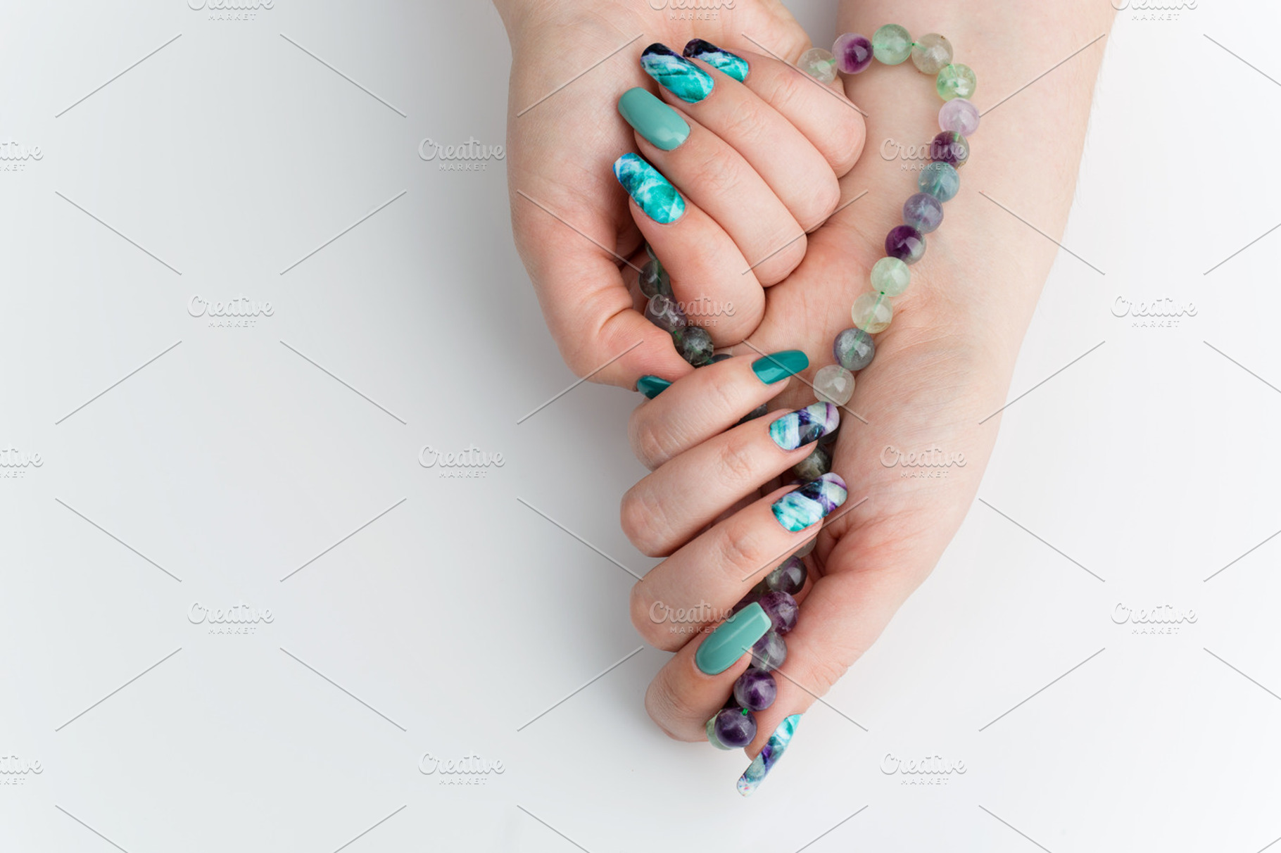 Closeup of woman hands with colorful nails containing fluorinate, fluorinit, a Beauty & Fashion Photo by Sweet Studio