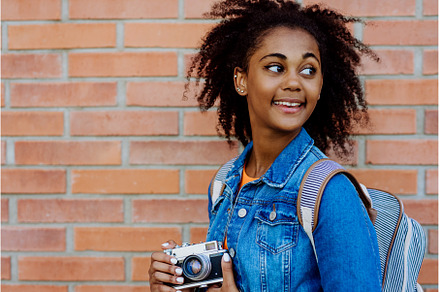 Multiracial girl standing in front, a Person Photo by HalfPoint