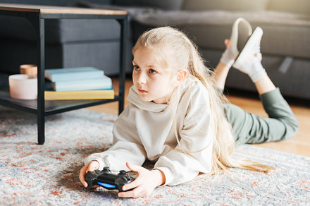 Girl playing video game at home, a Sports & Recreation Photo by Olena Rudo