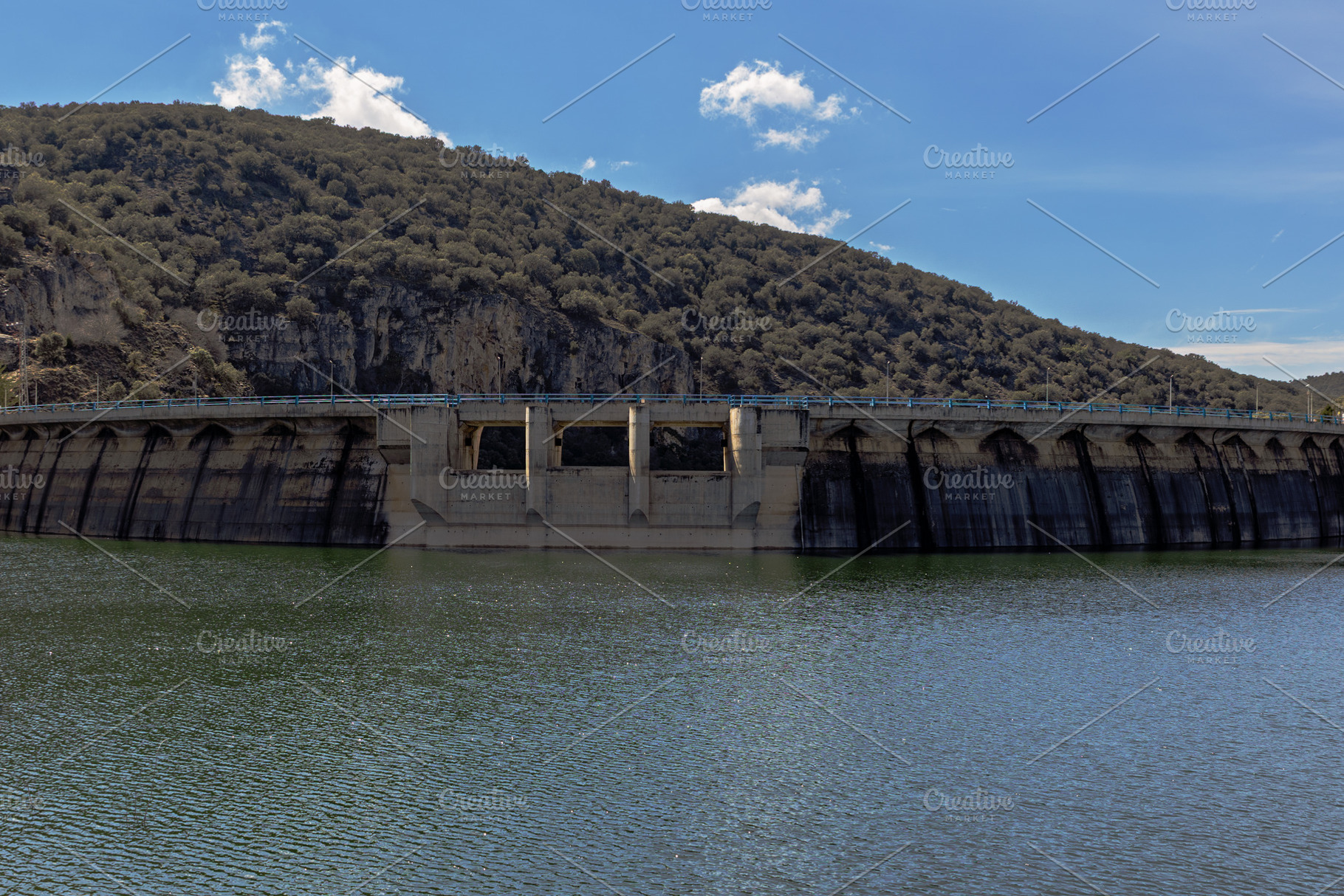 Concrete Dam Over a Reservoir with a, an Industrial Photo by Perpis