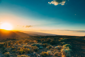 Sunset over the mountains stock photo containing sunset and mountains