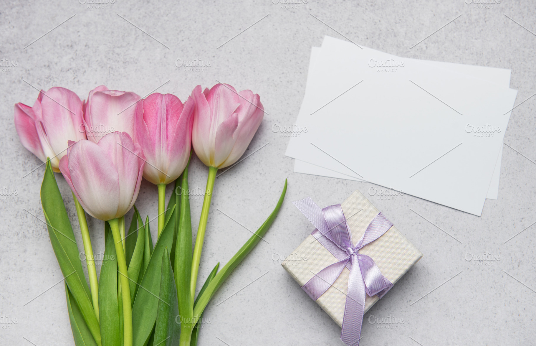 Pink tulips bouquet, gift box and blank cards creating festive c, a Holiday Photo by Olena Rudo