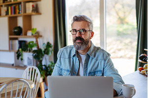 Man working from home office, a Person Photo by HalfPoint