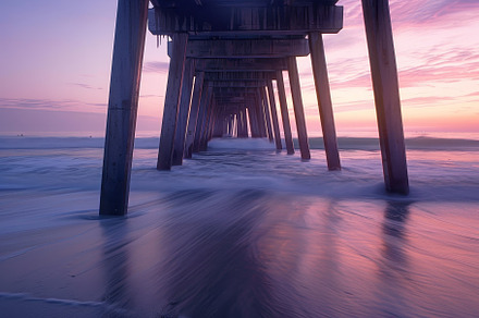 A stunning sunset lights up the sky, a Photo by Tanuart